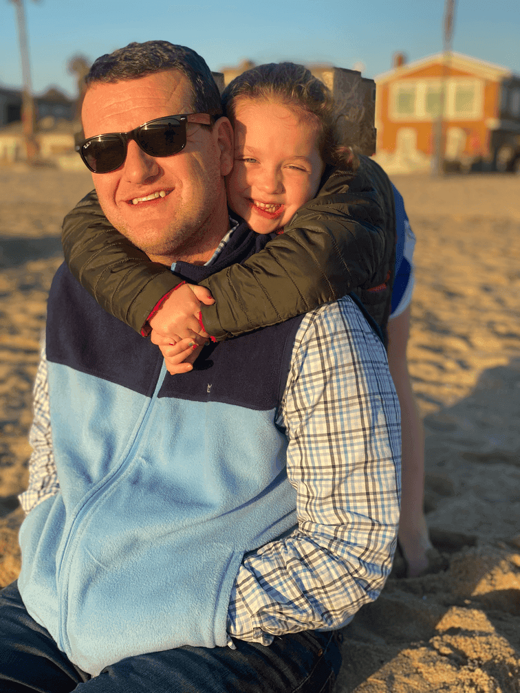 Michael Kittinger with his youngest daughter at the beach